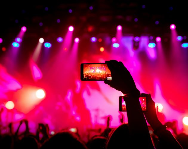 A Phone recording a concert at a Utilita Arena