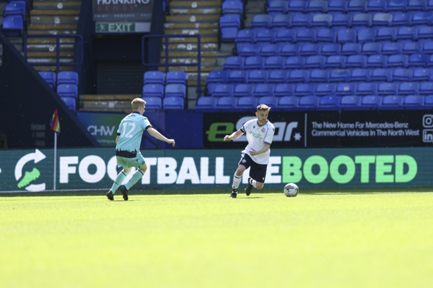 Players in front of Football Rebooted LED