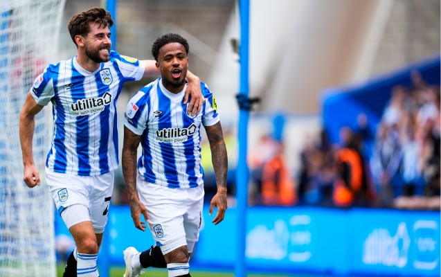 Utilita logo on Huddersfield Town front of shirt players