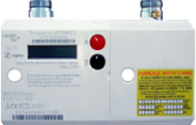 Landis & Gyr Gas Smart Meter with a green display, a red ‘A’ button, a black ‘B’ button, a barcode, and a yellow label